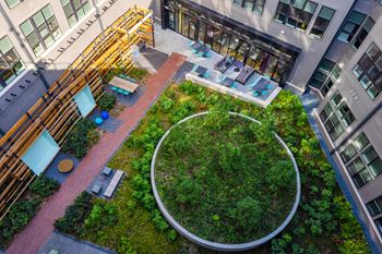 an aerial view of an office building with a green courtyard at The Chase at Bryant Street, Washington, 20002